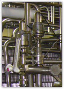 Close up of sanitary process piping in food processing plant